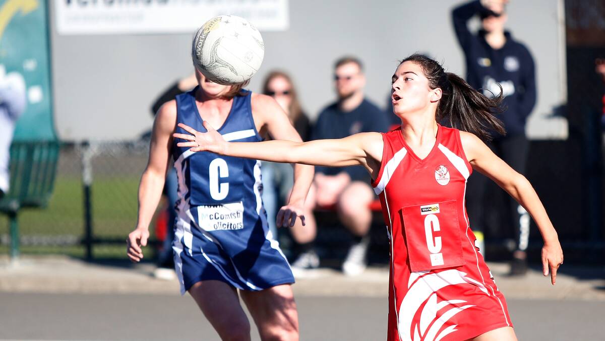 OUT OF REACH: South Warrnambool's Isabella Rea goes to catch the ball infront of Warrnambool's Sarah O'Keeffe. Picture: Mark Witte