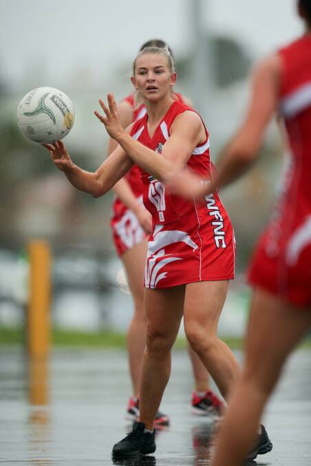 MOVING THE BALL: South Warrnambool star Carly Watson looks for a passing option in the wet. Picture: Chris Doheny