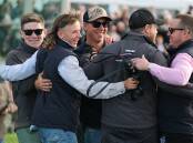 ALL SMILES: Symon Wilde and connections of Vanguard celebrate the gelding's victory in the 3YBFM Scotty Stewart Brierly Steeplechase. Picture: Morgan Hancock