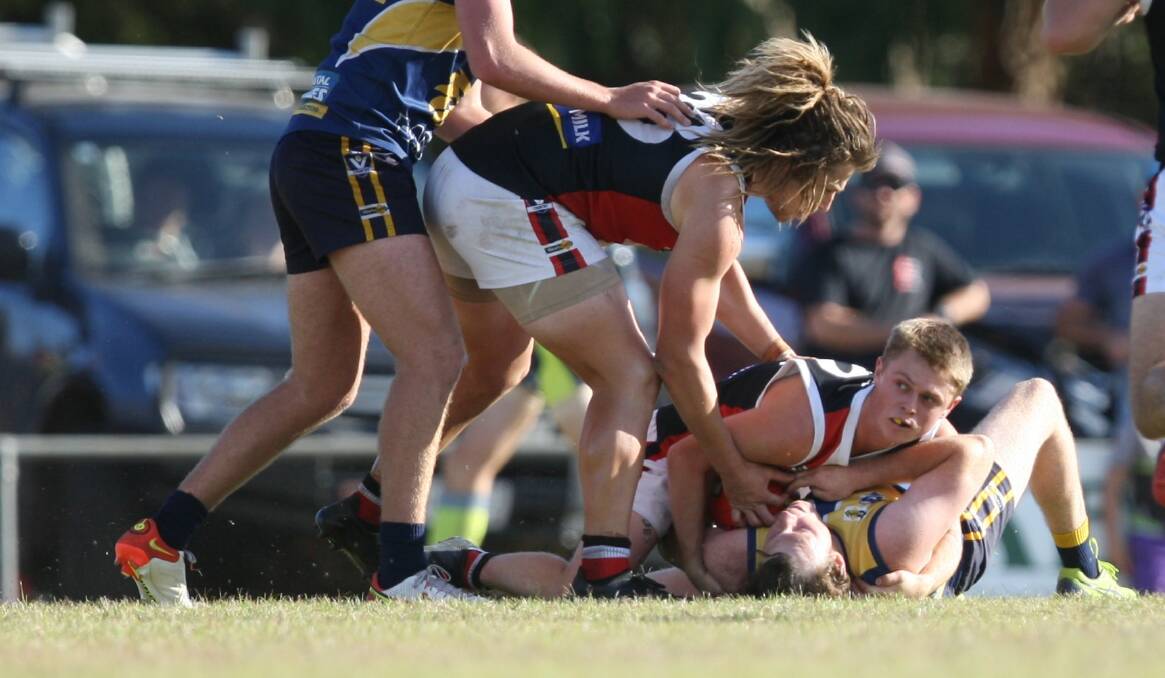 WRAPPED UP: Koroit's Jyron Neave pins the ball to secure a forward-half stoppage.