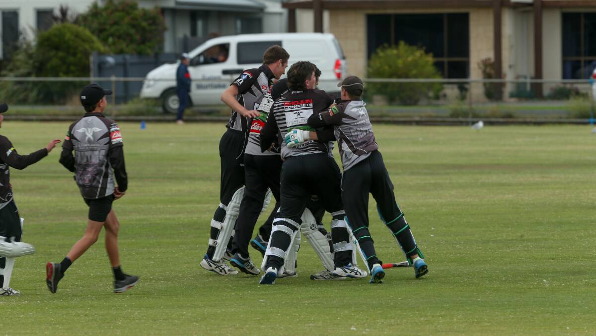 HAPPY TIMES: West Warrnambool players celebrate their win. Picture: Chris Doheny