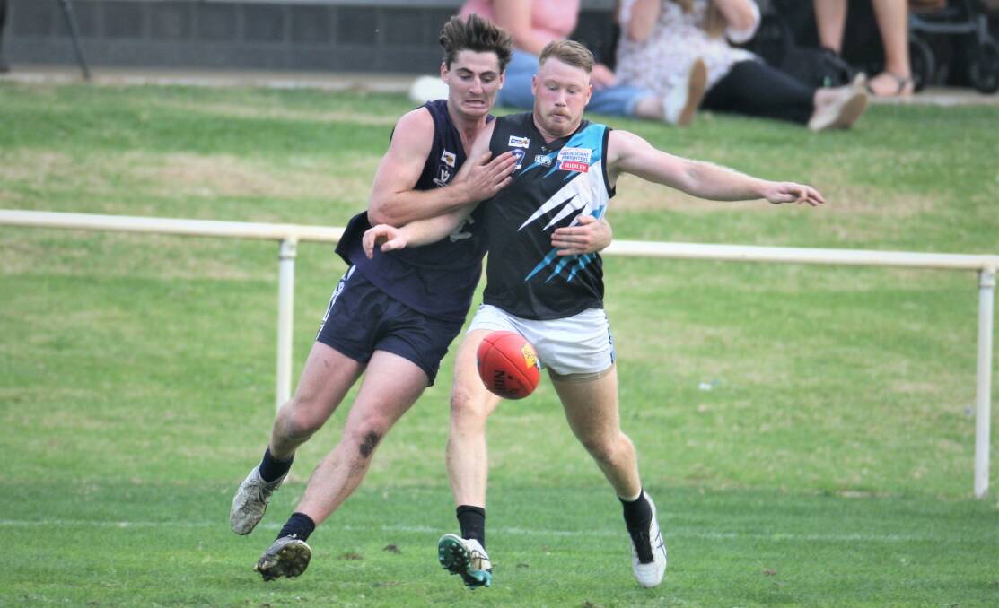FIFTY-FIFTY: Nirranda's Scott Carlin and Kolora-Noorat's Luke Tebble wrestle for the ball. Picture: Nick Ansell