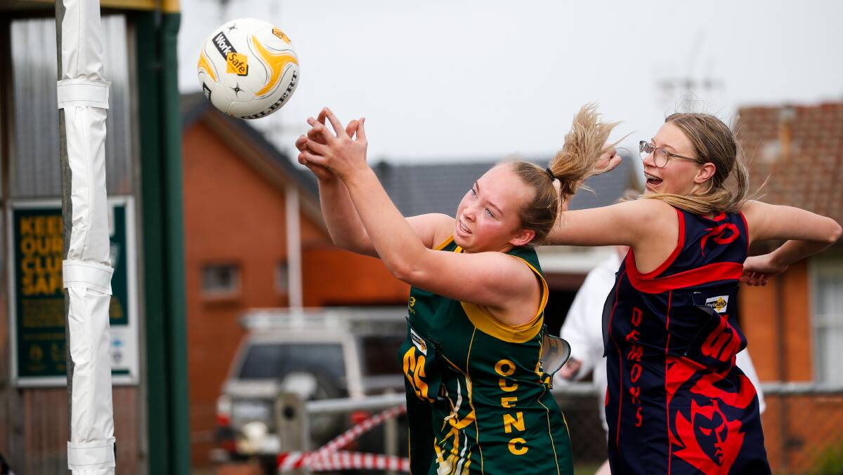 50-50: Old Collegians player Scarlett Hunter and Timboon Demons player Maya Steere contest the ball. Picture: Anthony Brady