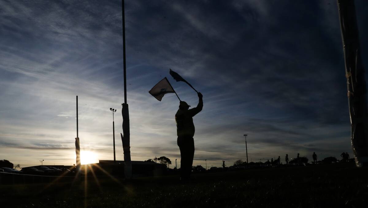 GOOD CALL: A goal umpire waves the flags to signal a major. The AFL has this week cracked down on dissent towards officials. Picture: Morgan Hancock