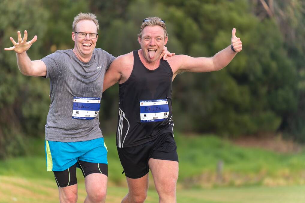 HAPPY DAYS: Andrew Wolstenholme and Daryl Baker enjoy the running. Picture: Jason Dargan