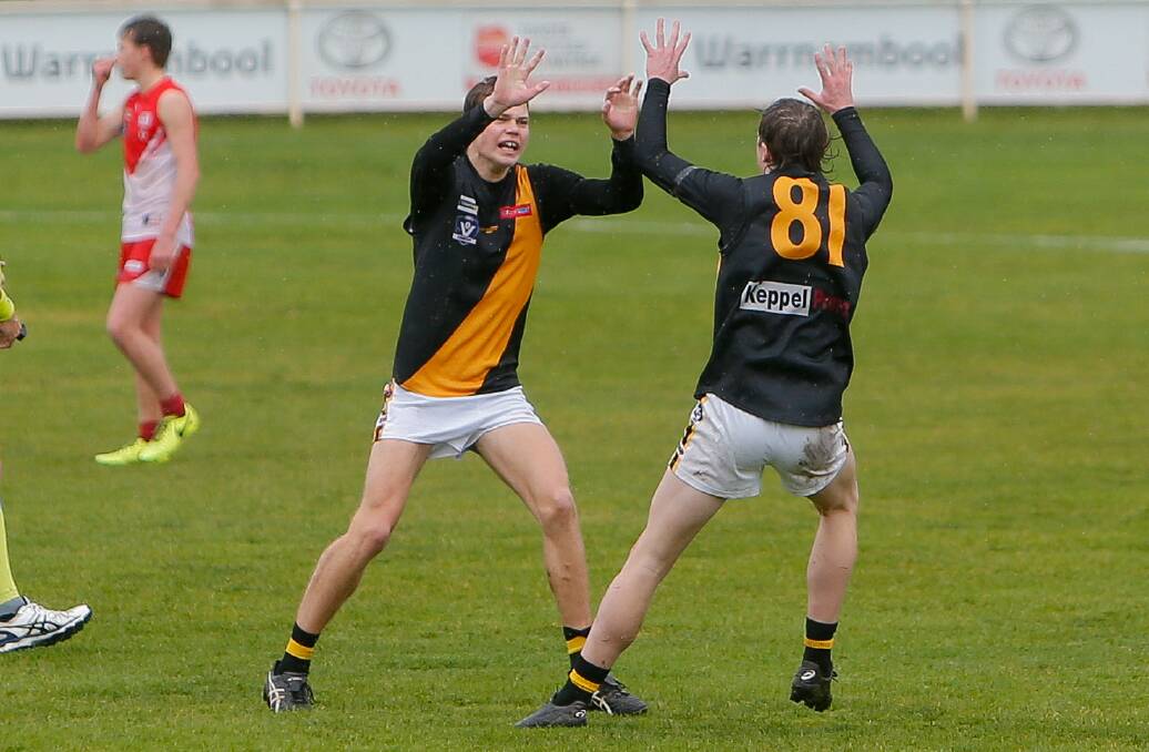 ON THE RISE: Portland under 18.5 players Jed Saunders and Josh Stiles celebrate a goal in last season's grand final. Picture: Anthony Brady