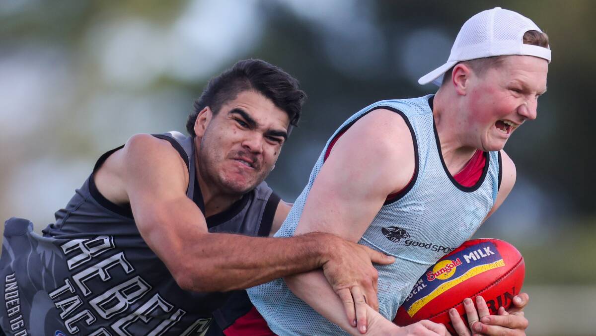 PUSHING THROUGH: Russells Creek's Zac Timms breaks a tackle at training. Picture: Morgan Hancock