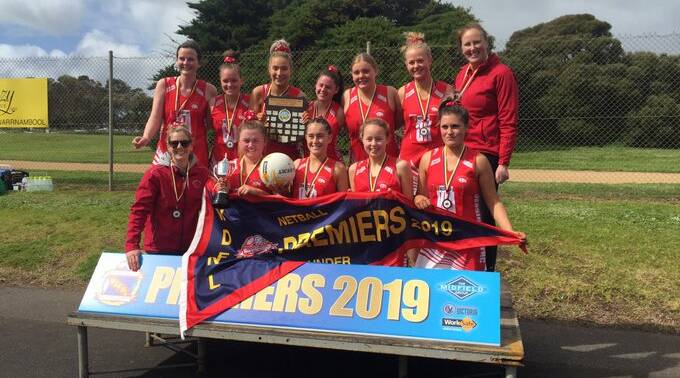 REWARD FOR EFFORT: Dennington's under 17 netballers lifted the premiership after two near misses. Picture: Nick Ansell