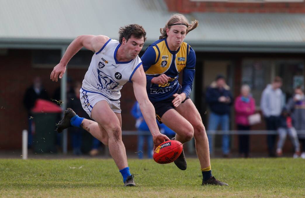 CRUNCH: North Warrnambool Eagles' Jett Bermingham readies a hip and shoulder on Hamilton Kangaroos' Charles Murrie. Picture: Anthony Brady