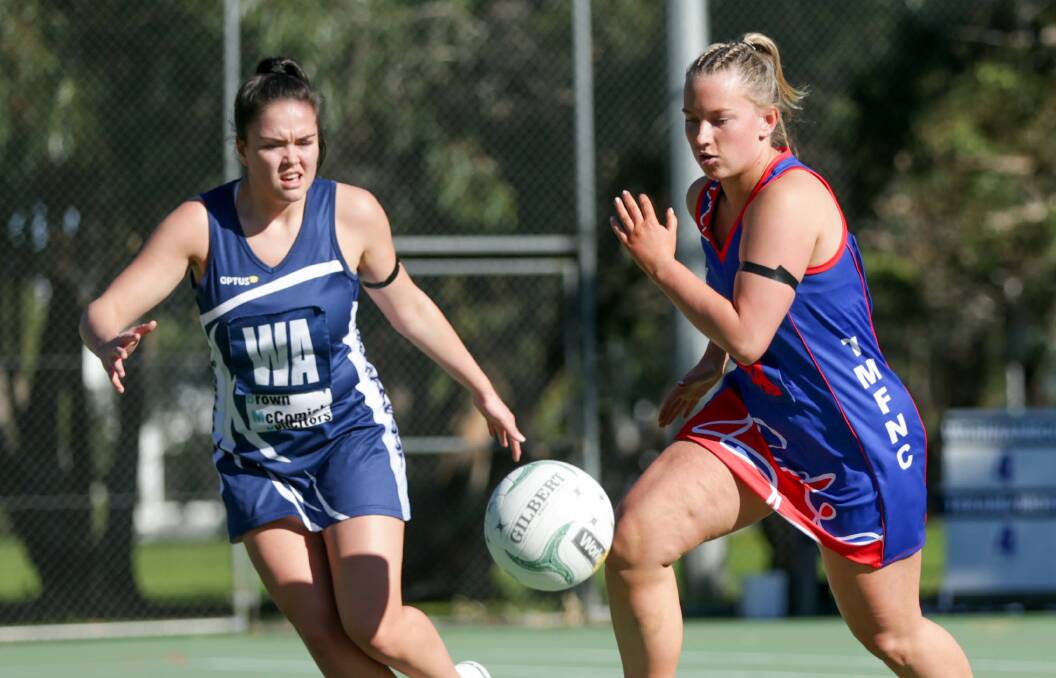 WORKING HARD: Terang Mortlake's Laura Ritchie and Warrnambool's Sarah Smith push for the ball. Picture: Chris Doheny