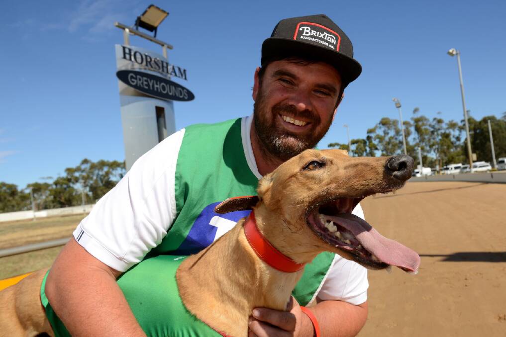 LONG ODDS: Horsham Cup chance Solitary Girl with trainer Dustin Drew. Picture: Greyhound Racing Victoria