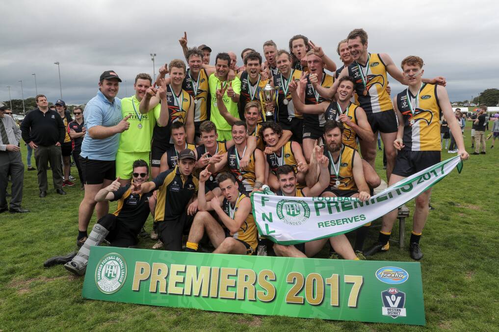 PROUD: North Warrnambool Eagles' reserves footballers celebrate their flag. Picture: Rob Gunstone