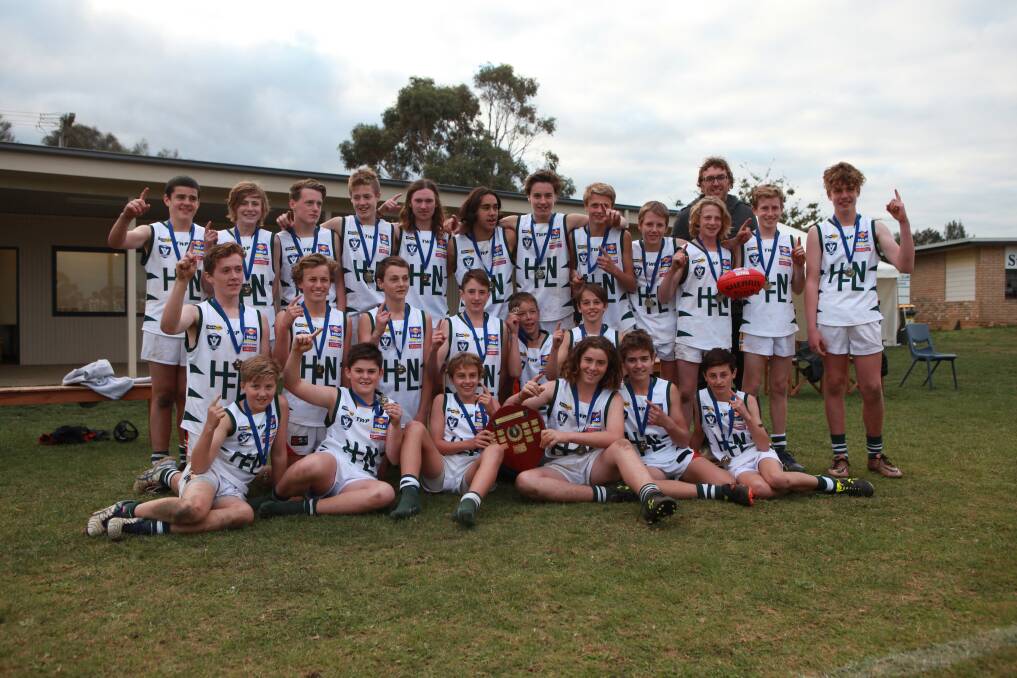 WINNERS ARE GRINNERS: Hampden White saluted in the under 14 age category, defeating Hampden Green by 14 points.