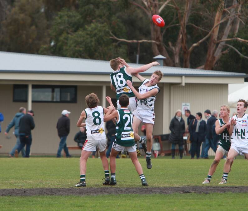 TEST OF SKILL: Terang Mortlake's Jordi Dwyer contests a ruck contest and wins the tap from his Hampden league opponent.