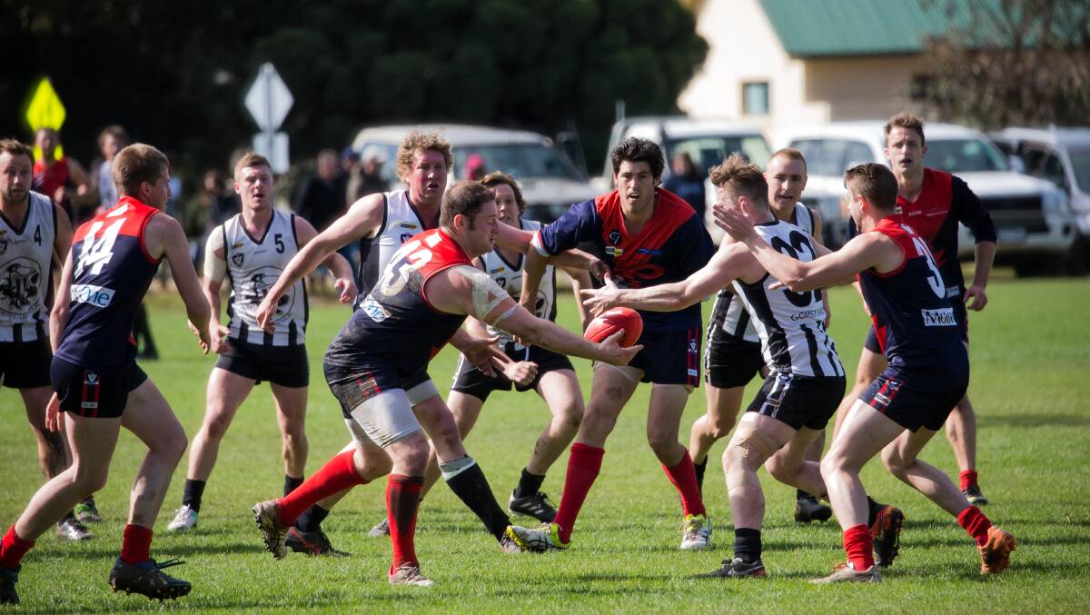 NO SPACE: Lismore Derrinallum's James Boag takes the ball in a congested pack of players.
