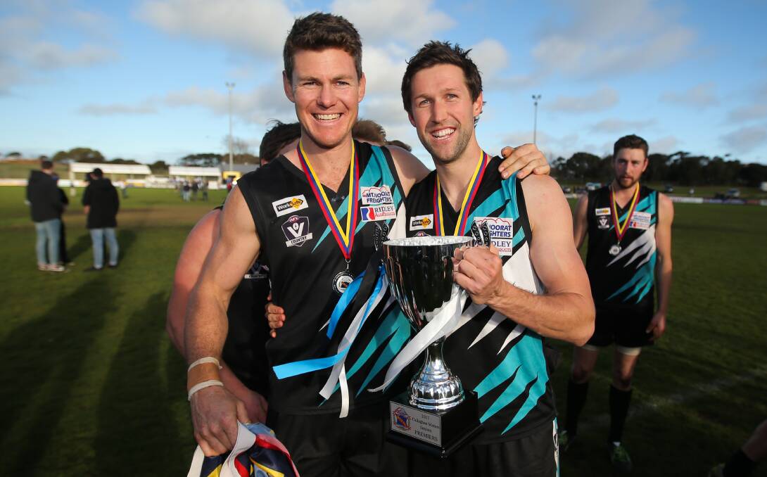 POWER TO RULE: Ben Fraser and Jason Moloney, two of the Power's Melbourne-based players, with the cup. Picture: Morgan Hancock