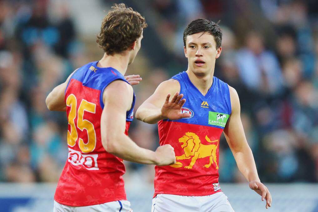 Ryan Lester of the Lions (L) and Hugh McCluggage celebrate a goal during the round 13 AFL match between the Port Adelaide Power and the Brisbane Lions at Adelaide Oval on June 17, 2017 in Adelaide, Australia. (Photo by Michael Dodge/Getty Images)