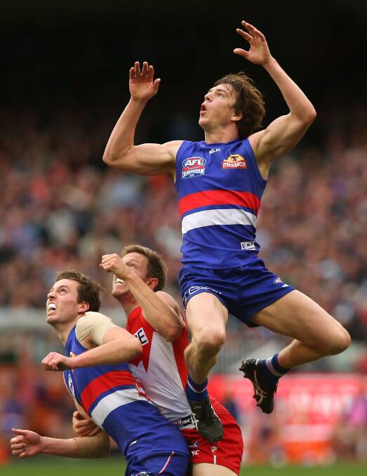 FLYING HIGH: Liam Picken soars for a spectacular grab in the AFL grand final. Picture: Graham Denholm/Fairfax Media.