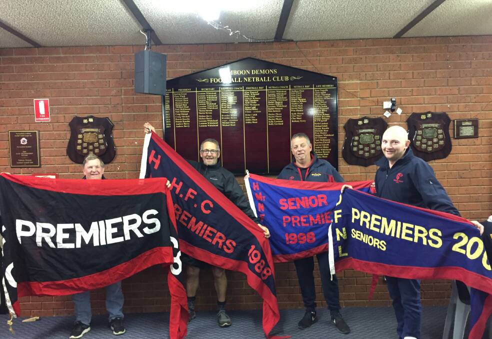 Proud: Doug Trigg, Mick Hunt, Mark Delaney and Brendan Hickey happily show off four of the club's premiership flags from 1968, '88, '98 and 2008.