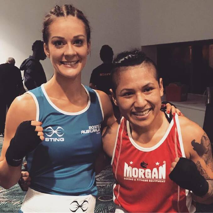 Foes to friends: Hamilton's Katie Barker and opponent Astryd Carmelo share a special moment after their bout at last week's World Championships selection event at Perth.