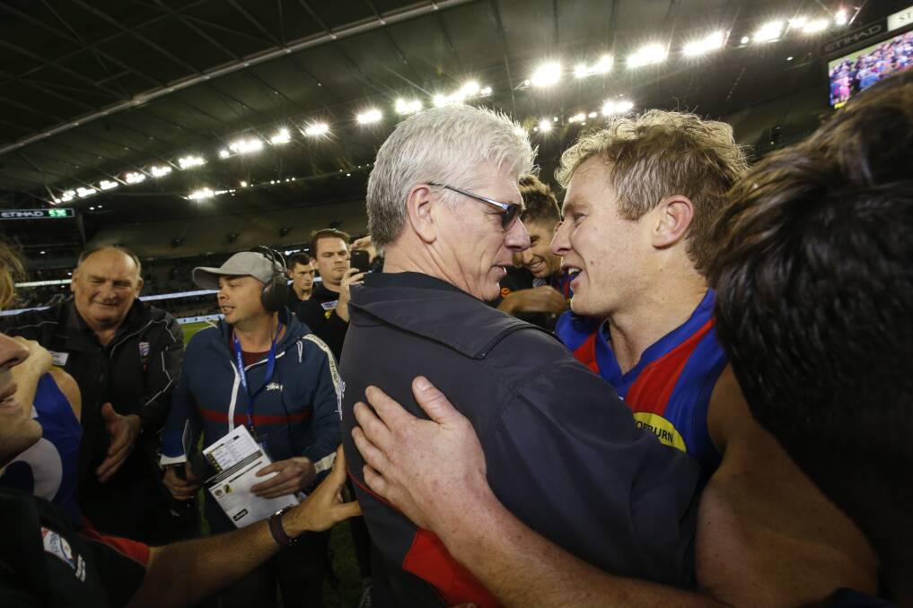 Strong bond: Warrnambool export Sam Dwyer and coach Gary Ayres celebrate after Port Melbourne's VFL premiership in 2017. Picture: Darrian Traynor/AFL Media