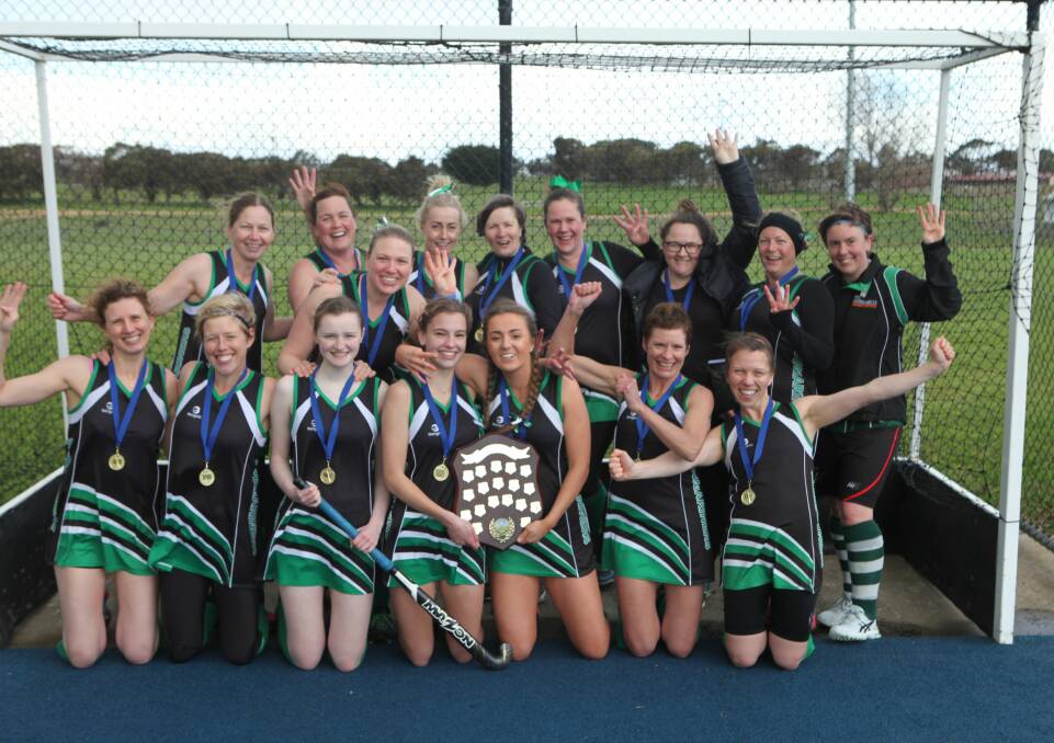 Unbeatable: Submariners celebrate after winning their fourth consecutive women's premiership in the Warrnambool and District Hockey Association. Picture: Nick Brown