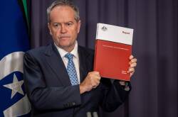 Government Services Minister Bill Shorten with the robodebt royal commission report. Picture by Gary Ramage