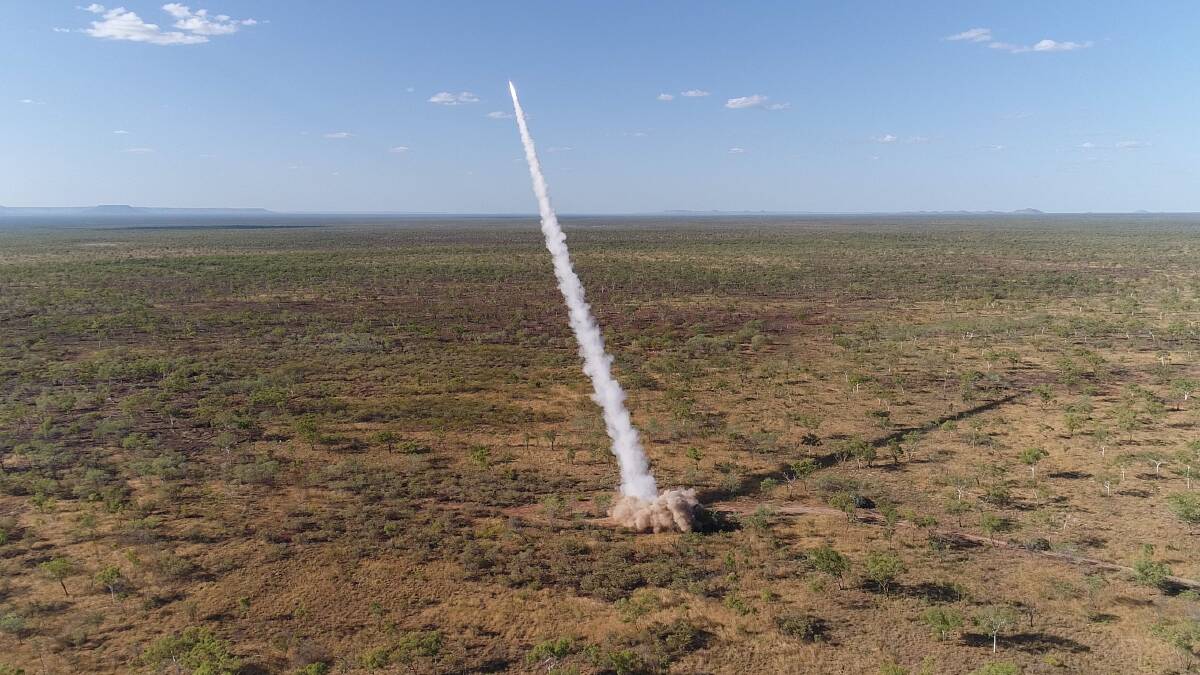 A M142 High Mobility Artillery Rocket System (HIMARS) fires a guided rocket against targets in the Northern Territory. Picture Defence