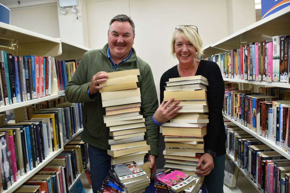 Bookworms: Portland library user Mark Angelino and Glenelg Libraries manager Yvette Parker are calling on book-lovers to increase their reading to help ease the library's  load on moving day.