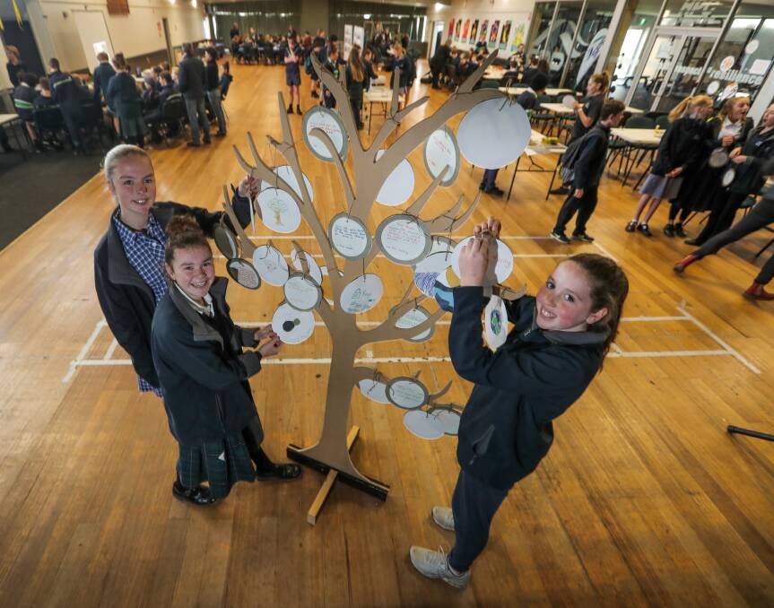 Ideas: Warrnambool College students Ayla Henderson, 14, Lexie Finnigan, 13, and Amber Cooke, 13, are getting creative at the 'Unfurling Ideas' event. Picture: Rob Gunstone