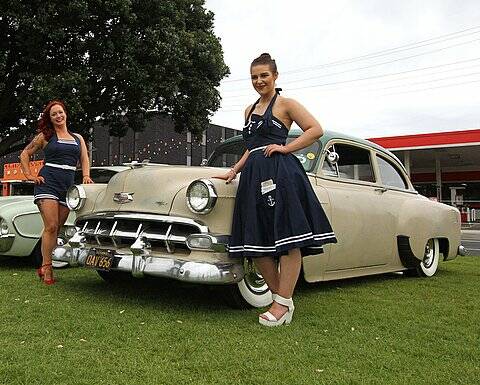 Glamorous: Clare Haywood and Shelby Katsaros showcase 1950's style at the finish line to the Melbourne to Warrnambool Cycling Classic. Picture Supplied