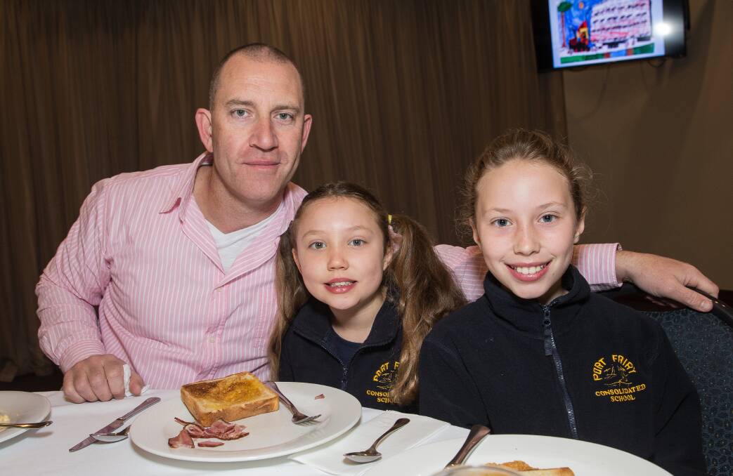 Winning dad: Port Fairy father-of-three Adrian Hallam celebrates winning the 2018 Father of the Year award with daughters Mackenzie, 6 and Georgia, 9. Picture: Christine Ansorge.