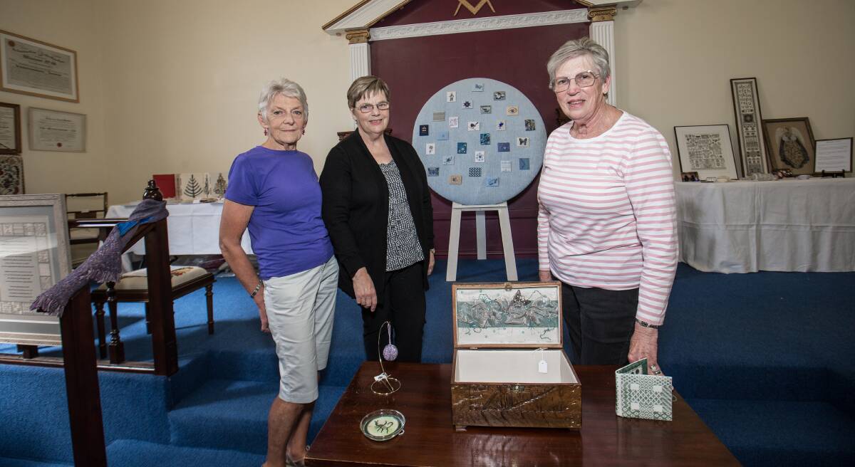 Stitched: Embroiderers Guild Victoria members Pauline Riddle, Lorraine Blackmore and Judy Miller are hosting their biennial exhibition at the Masonic Hall on the weekend. Picture: Christine Ansorge