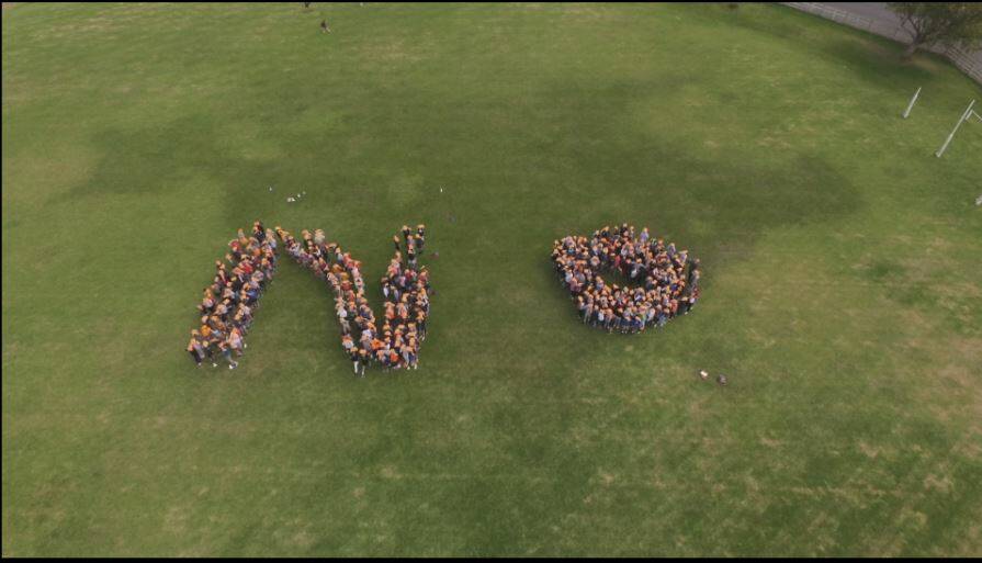 Say it loud: Emmanuel College students formed the word 'NO' on the schools oval on Friday as part of the national 'Bullying No Way' campaign.