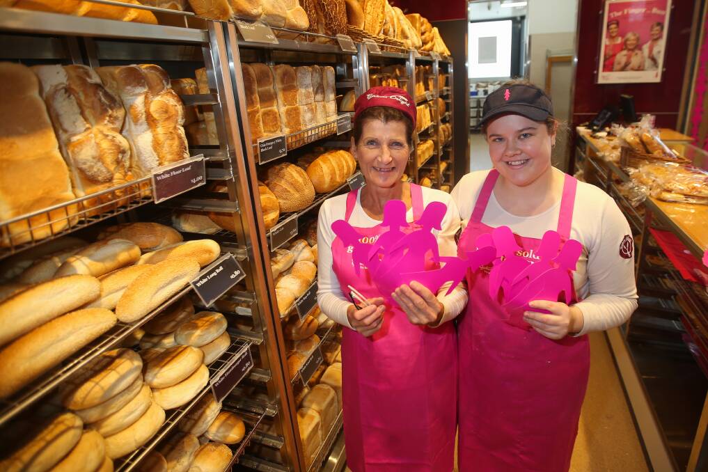 Delighted: Warrnambool East Bakers Delight staff members Jenny Goodman and Cayla Bamford are tickled pink to support the Breast Cancer Network through pink bun sales during May. Picture: Morgan Hancock