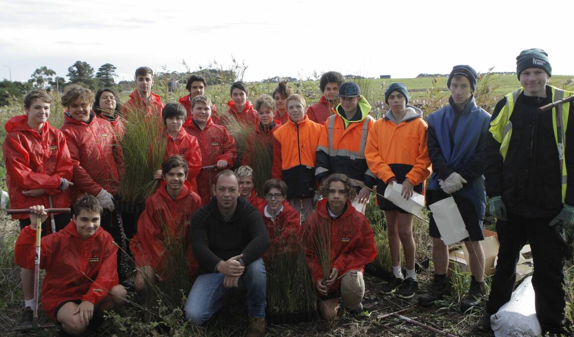 Growing: The Warrnambool Clontarf Academy joined boys from the Warrnambool Special Development School in revegetating the fringe of the Merri River under the guidance of WCC's Matt King. Picture: Rebecca Riddle.