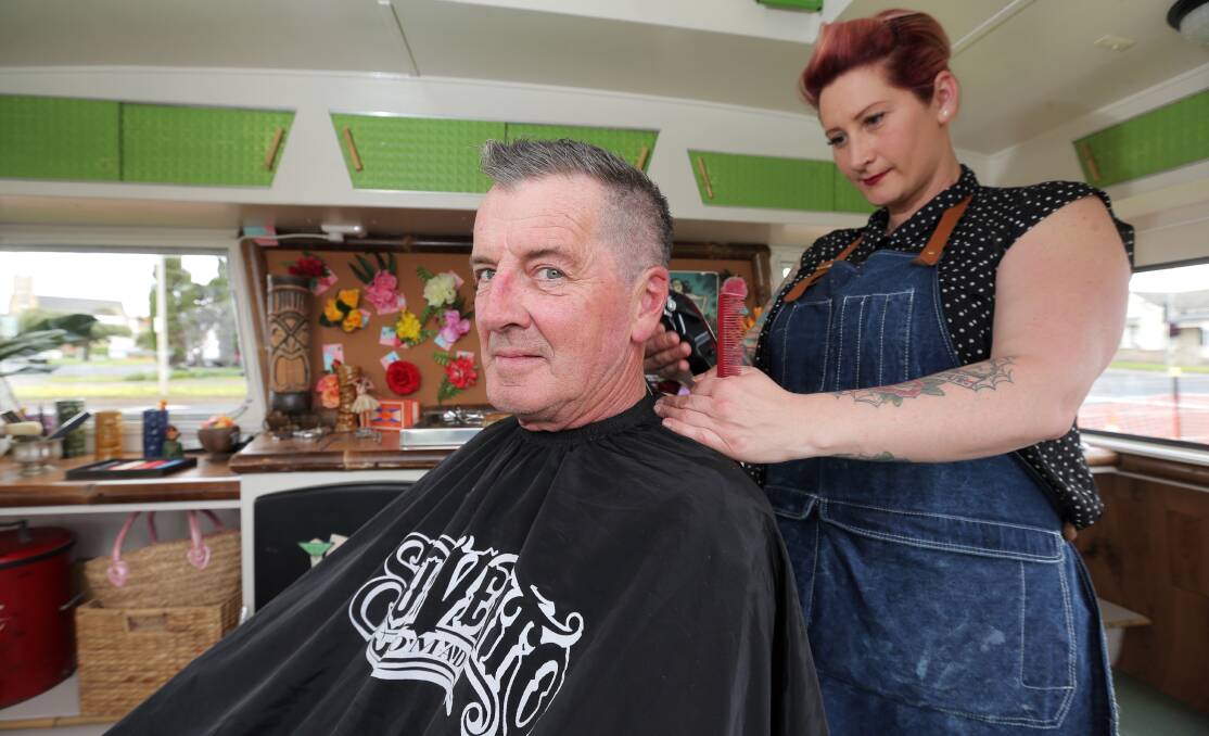 Cuttin' a style: Warrnambool's Rockabilly Heads hairdresser Ellissa Cuolahan-Clarke gives dad Brian Cuolahan a new 1950s stylish look. Picture: Rob Gunstone