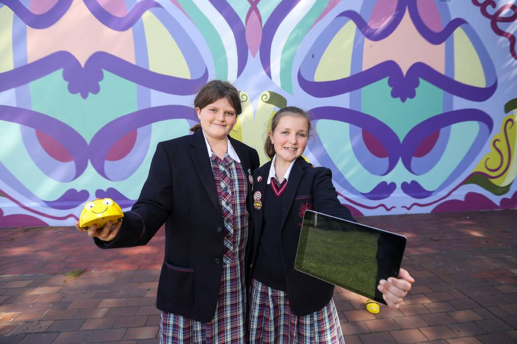 Go girls: Emmanuel College students Rianna Kelly, 12 and Emily Hawkins, 12 are encouraging more girls to try WAG's STEAM workshops on the weekend. Picture: Morgan Hancock