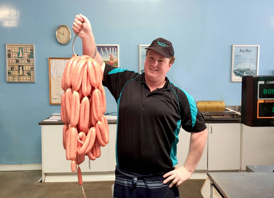 Snagged: Port Fairy's Sheehan's Meats staff member Zac Arnott said the weather conditions in January were helping the unusually high demand for sausages. Picture: Rebecca Riddle.