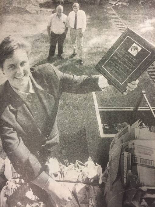 Rubbish: Warrnambool City Council then-student environmental health officer Kerryn Allen proudly holds an award presented for the city's remarkable turnaround in recycling as Frank Ryan and Murray Murfett look on. APRIL 1992.