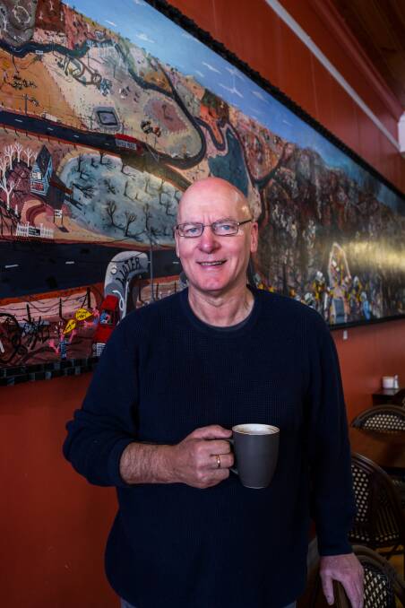 Coffee art: Warrnambool artist Glenn Morgan has installed his art at a Liebig Street cafe to give coffee-lovers a distraction during roadworks. Picture: Christine Ansorge.