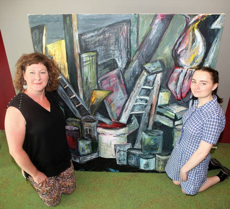 Treasure: Warrnambool College Art teacher Anthea Rafferty and Year 10 student Sophie O'Brien are uncovering school history through art. Picture: Anthony Brady
