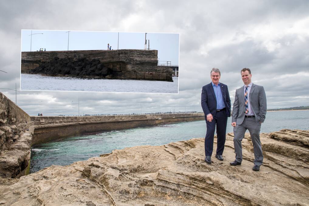 Rock solution: Mayor Robert Anderson and the council's Scott Cavanagh. Inset: Rocks like these at the east end need to be added along the breakwater. Picture: Christine Ansorge