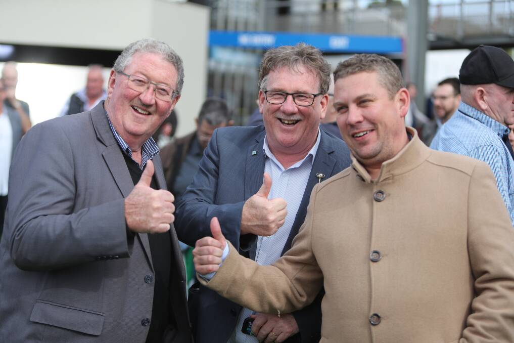 Winners: Trainer Trent Busuttin (right) joins Dennis Foley (left) and Garry Jones after winning race four, a 1200-metre maiden on the opening day of the carnival. Picture: Morgan Hancock 