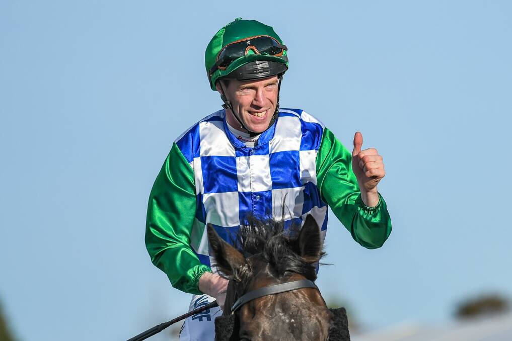 Thumps up: John Allen acknowledges the crowd after claiming consecutive Warrnambool Cups. Picture: Alice Laidlaw/Racing Photos