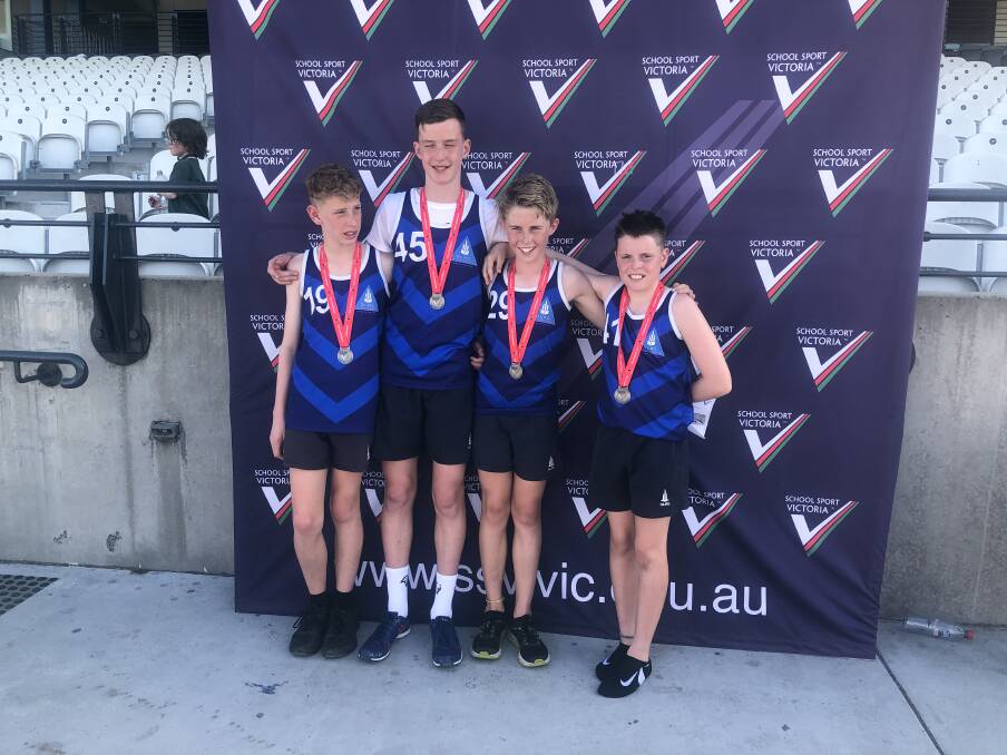 TOP TEAM: The 12-13 boys relay team of Hunter Cross, Kayne Rae-Rentsch, Sam Rhodes and Callum Leahy celebrate together after securing a silver medal.