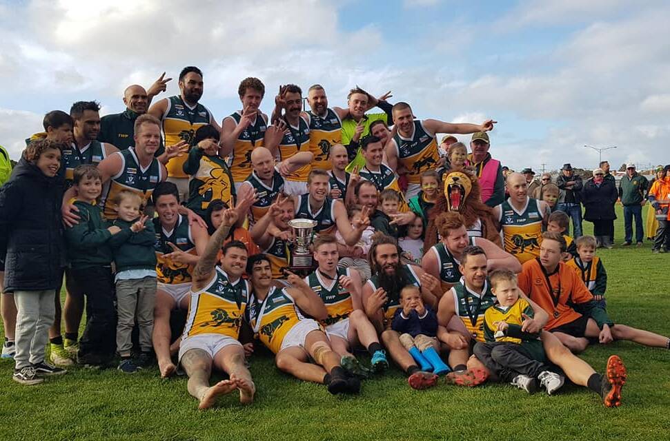 DOUBLING UP: Heywood players celebrate their second consecutive SWDFNL premiership. Picture: South West District Football Netball League 