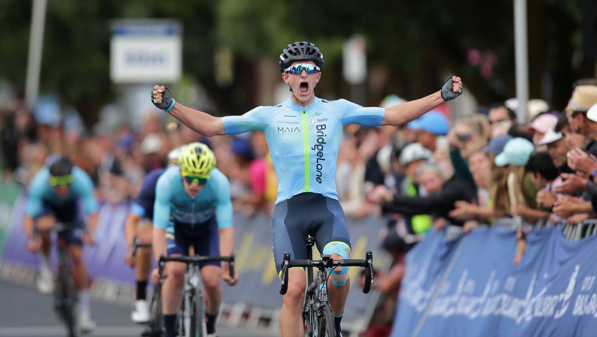 Nick White celebrates as he crosses the line to claim the under 23 Road National Championships. Picture: John Veage