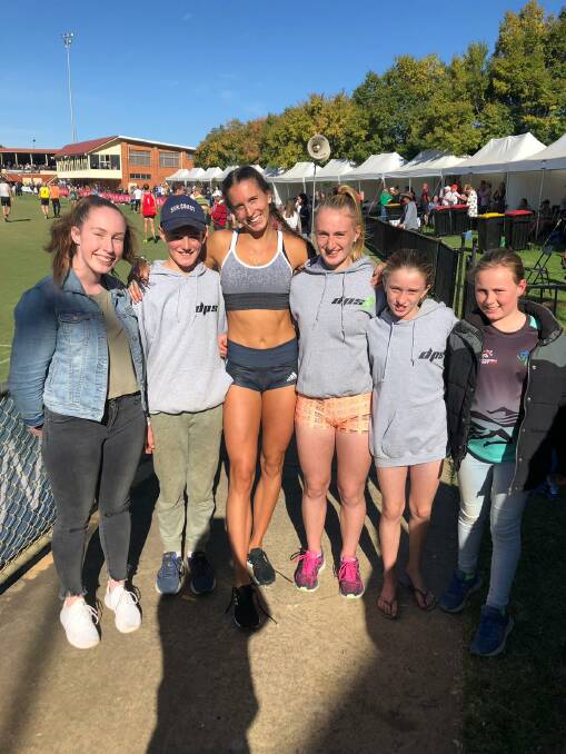 STAR PHOTO: Some of Warrnambool's upcoming sprint stars pose for a photo with Australian representative Maddie Coates (middle) at the Stawell Gift.