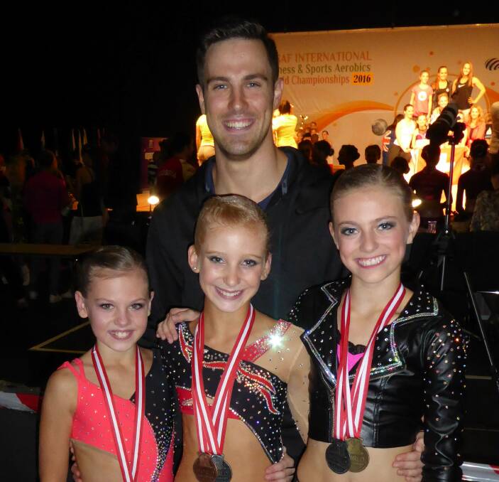'PROUD DAD MOMENT': Brenton Andreoli with his successful cadet trio at the Federation of International Sport Aerobics and Fitness (FISAF) world championships in 2016